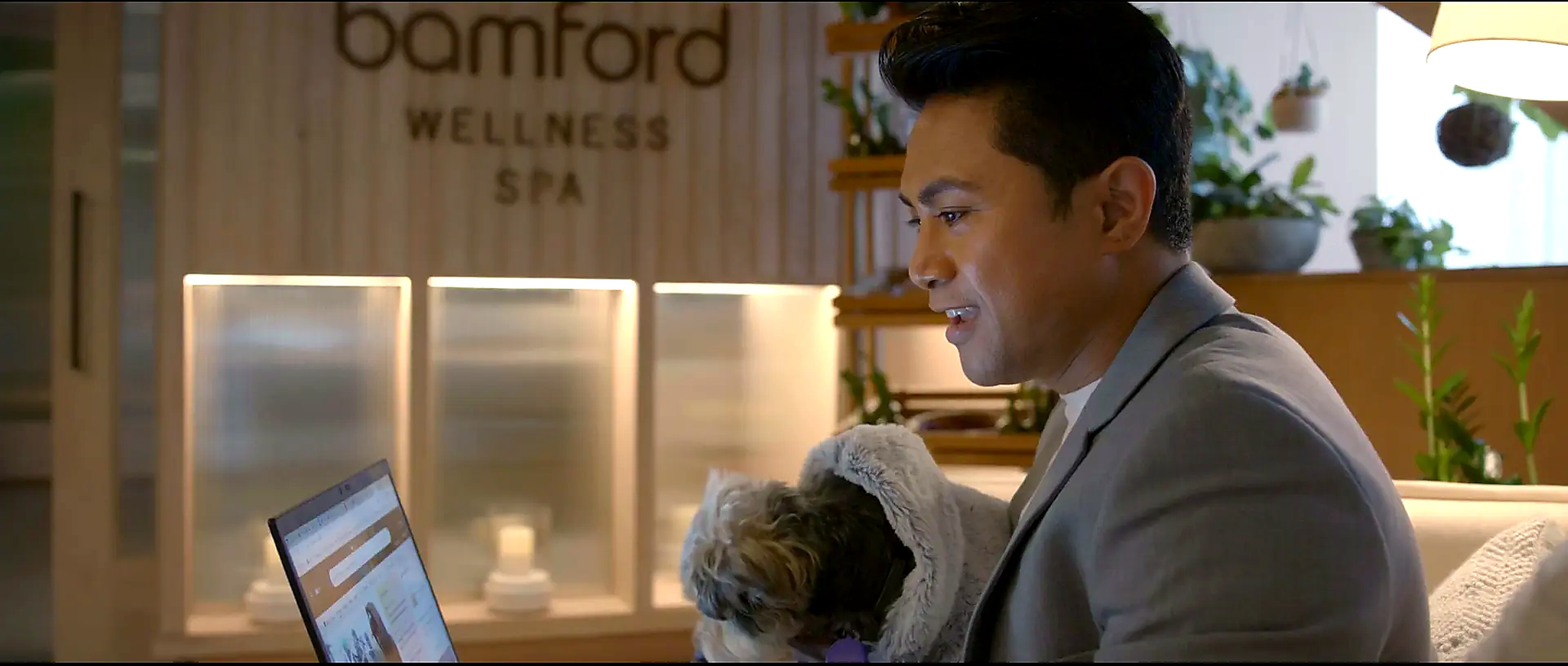 1Hotel team member with a small dog at the Bamford Wellness Spa