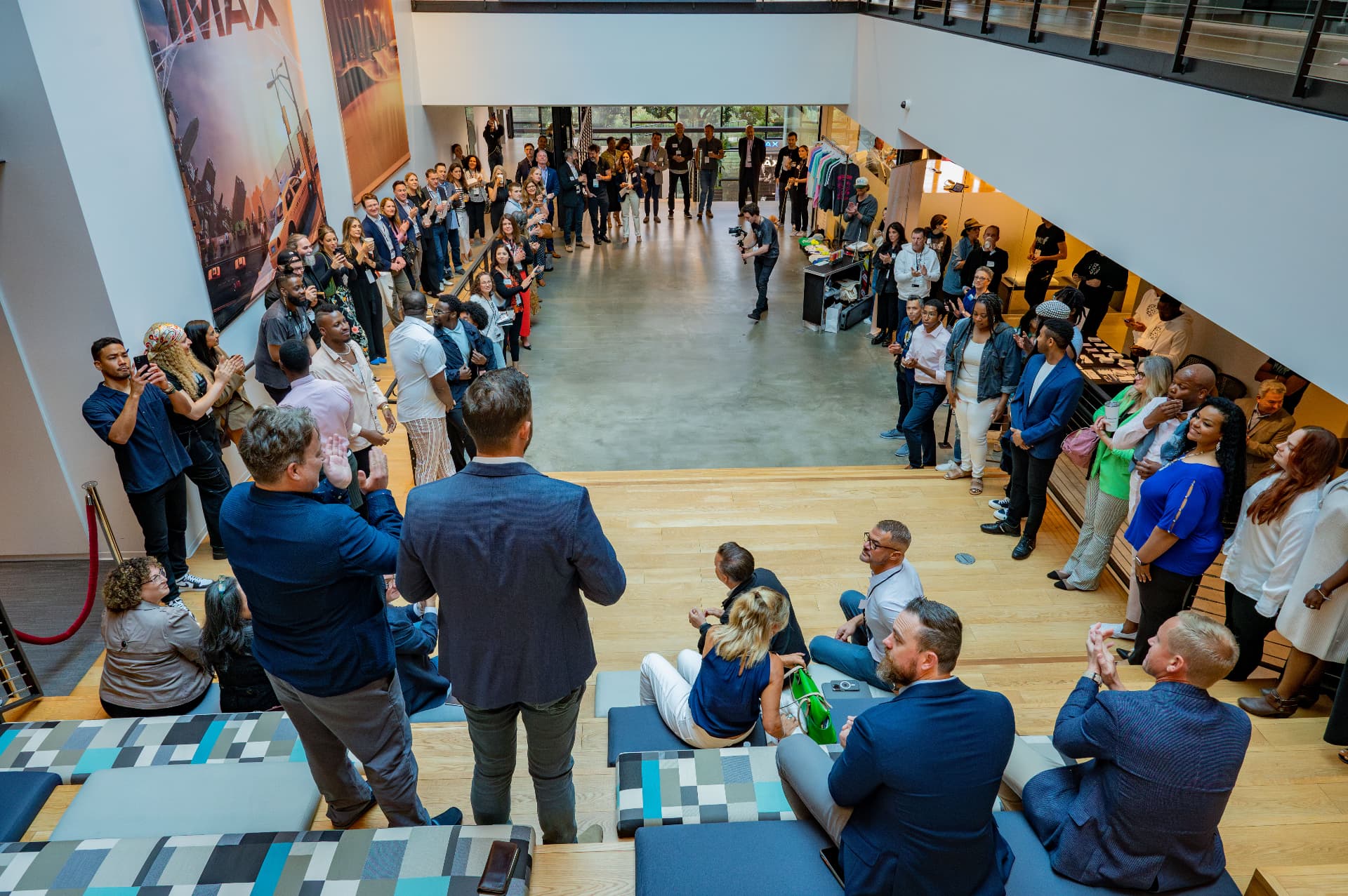 Overhead view of guests gathered around a lobby stage