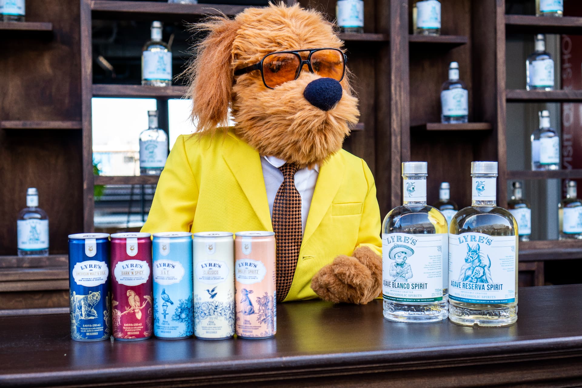 Bark Barkington, WUF's news anchor mascot in a yellow suit, staffing the bar