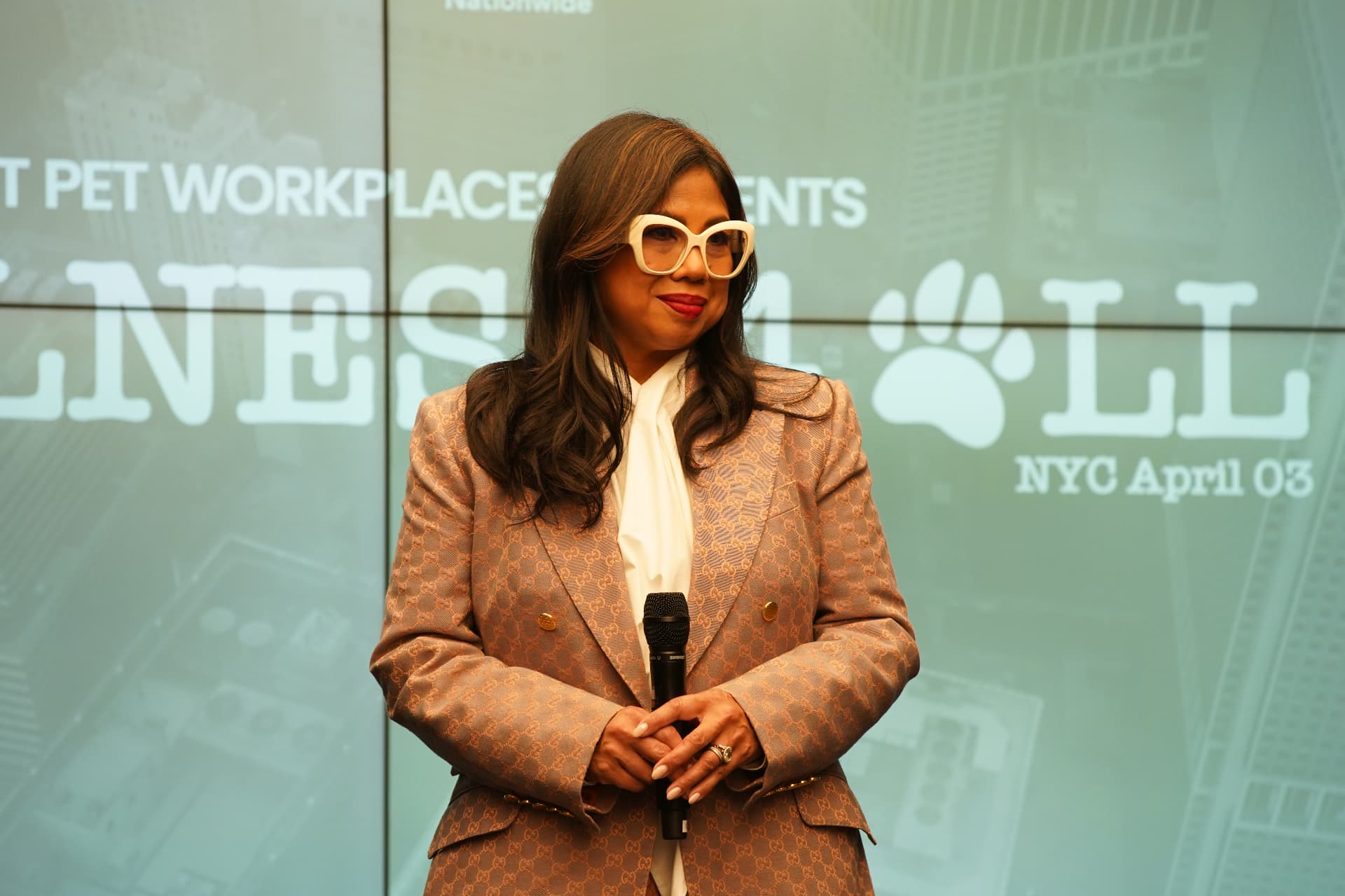 Speaker in a tailored blazer at the Wellness 4 All keynote in NYC